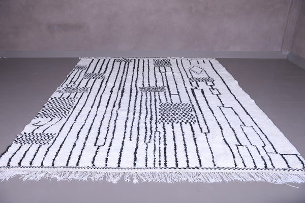 Custom white Moroccan wool rug with black geometric patterns