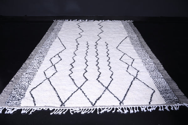 Custom white Moroccan rug with black geometric patterns