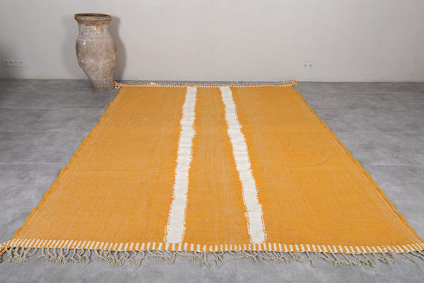 Handmade flatwoven yellow rug with white stripes