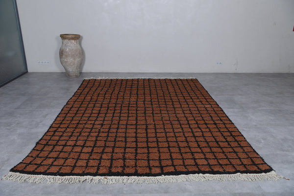 Brown moroccan rug with bold black checkered design