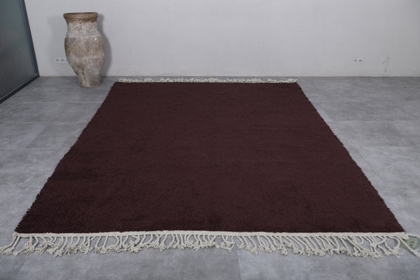 Rich brown Moroccan rug with white fringes