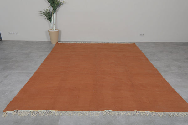 Flatwoven custom Moroccan rug in terracotta