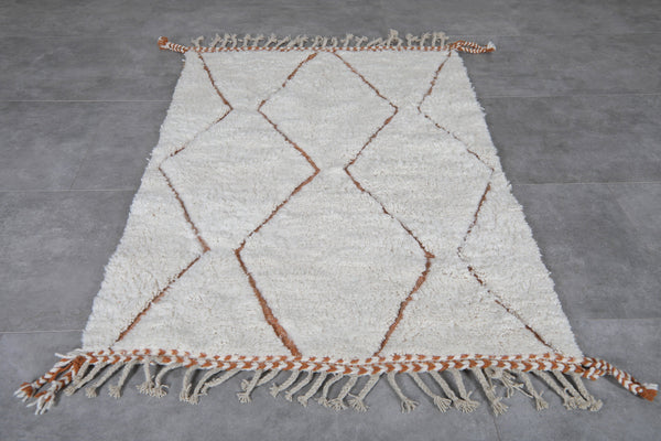 Custom white wool rug with brown geometric patterns
