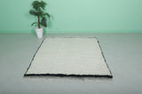 Minimalist Moroccan Rug with Black Border – 5.2 x 6.6 ft, Handwoven Ivory