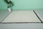 Minimalist Moroccan Rug with Black Border – 5.2 x 6.6 ft, Handwoven Ivory