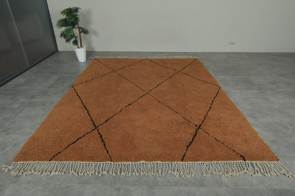 Brown custom Moroccan rug with black patterns