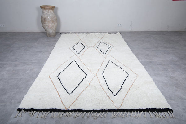 Elegant white wool Moroccan rug with unique patterns