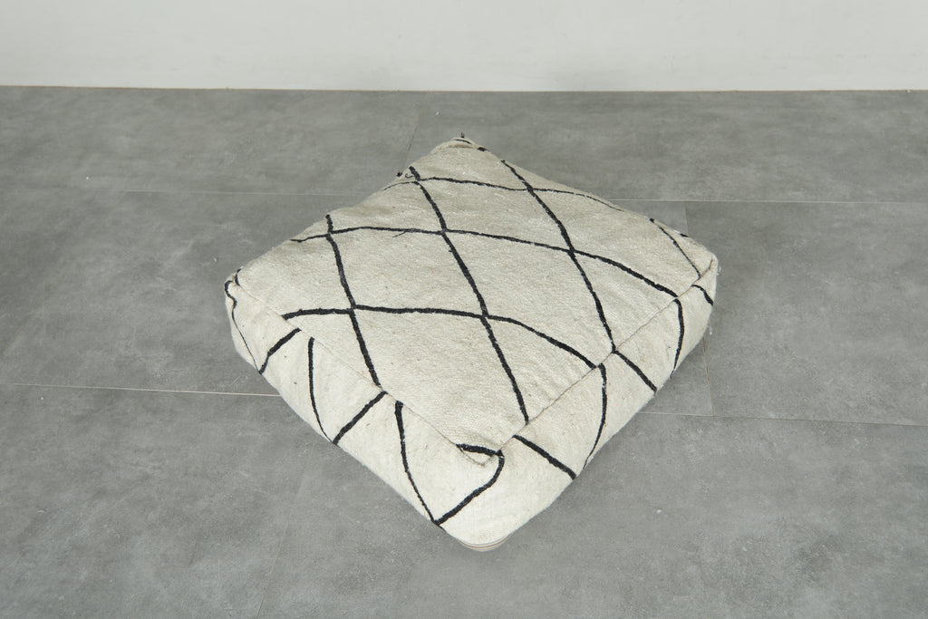 Minimalist white and black Moroccan kilim pouf