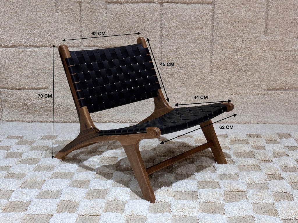 Handmade black Moroccan lounge chair – Woven leather & solid wood accent seating