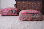 Two moroccan berber hamdmade red rug poufs