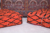 Two handmade berber red orange rug poufs