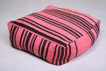 Two moroccan berber handmade pink woven poufs