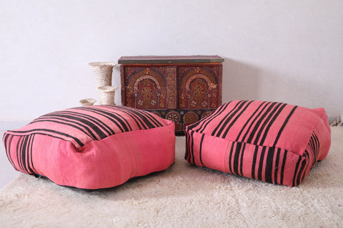 Two moroccan berber handmade pink woven poufs