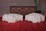 Two handmade berber moroccan rug ottoman poufs