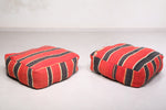 Two Moroccan Flatwoven black and red woven rug poufs