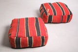 Two Moroccan Flatwoven black and red woven rug poufs