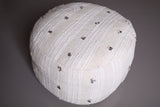 Two round handmade berber moroccan woven poufs