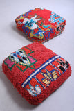 Two handmade handmade rug poufs