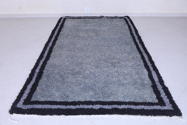 Handmade Moroccan rug in gray with double black border – 5.3 x 9 ft